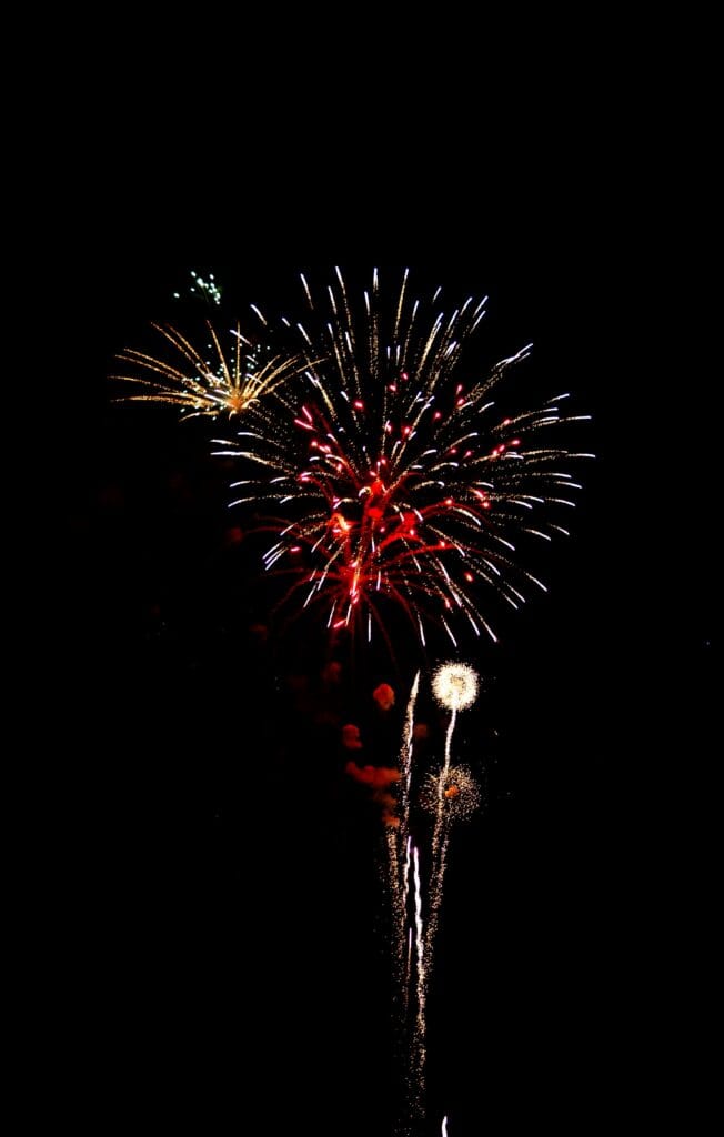 South Padre Island fireworks over the bay during evening charter tour