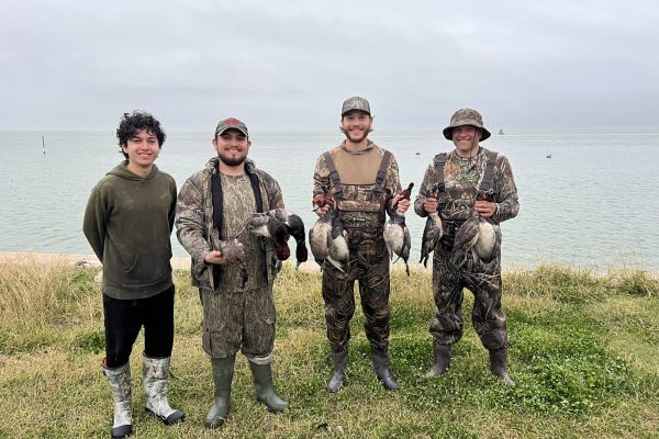 IMG_3314 Guided South Texas duck hunt with camo-clad hunter and retriever at sunrise